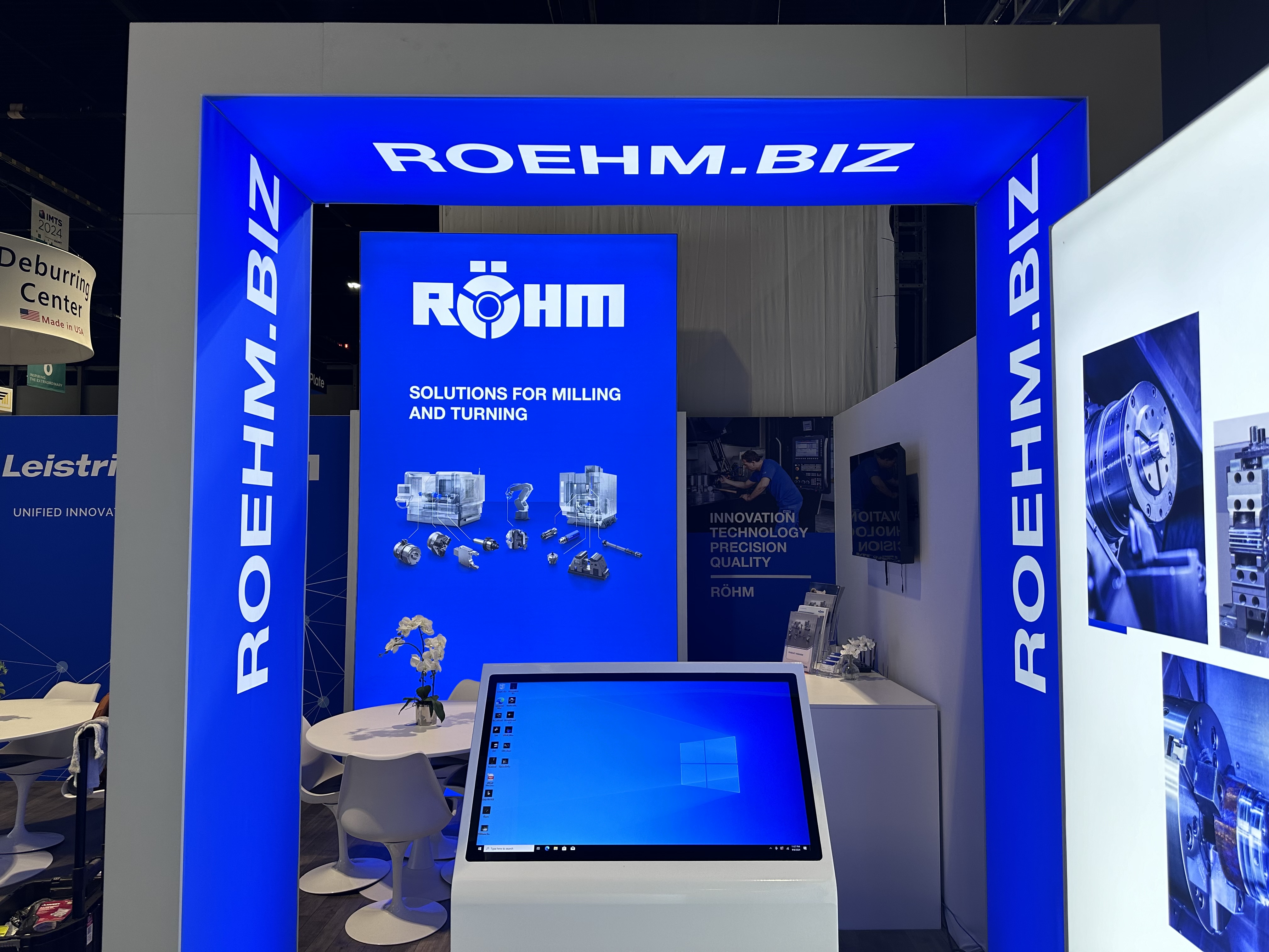 Blue illuminated industrial product display and digital media wall